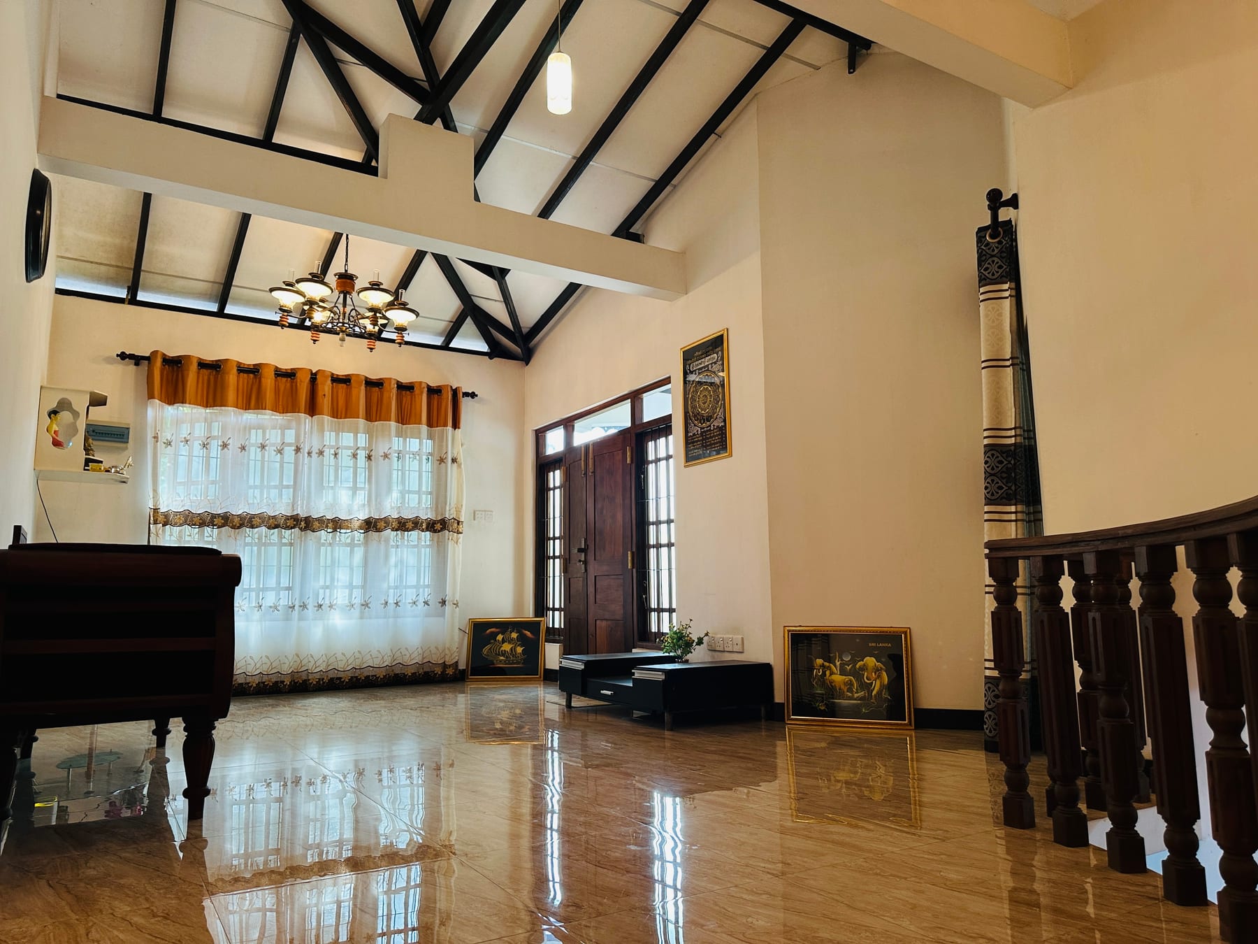 High-ceiling hall with timber beams and polished floor