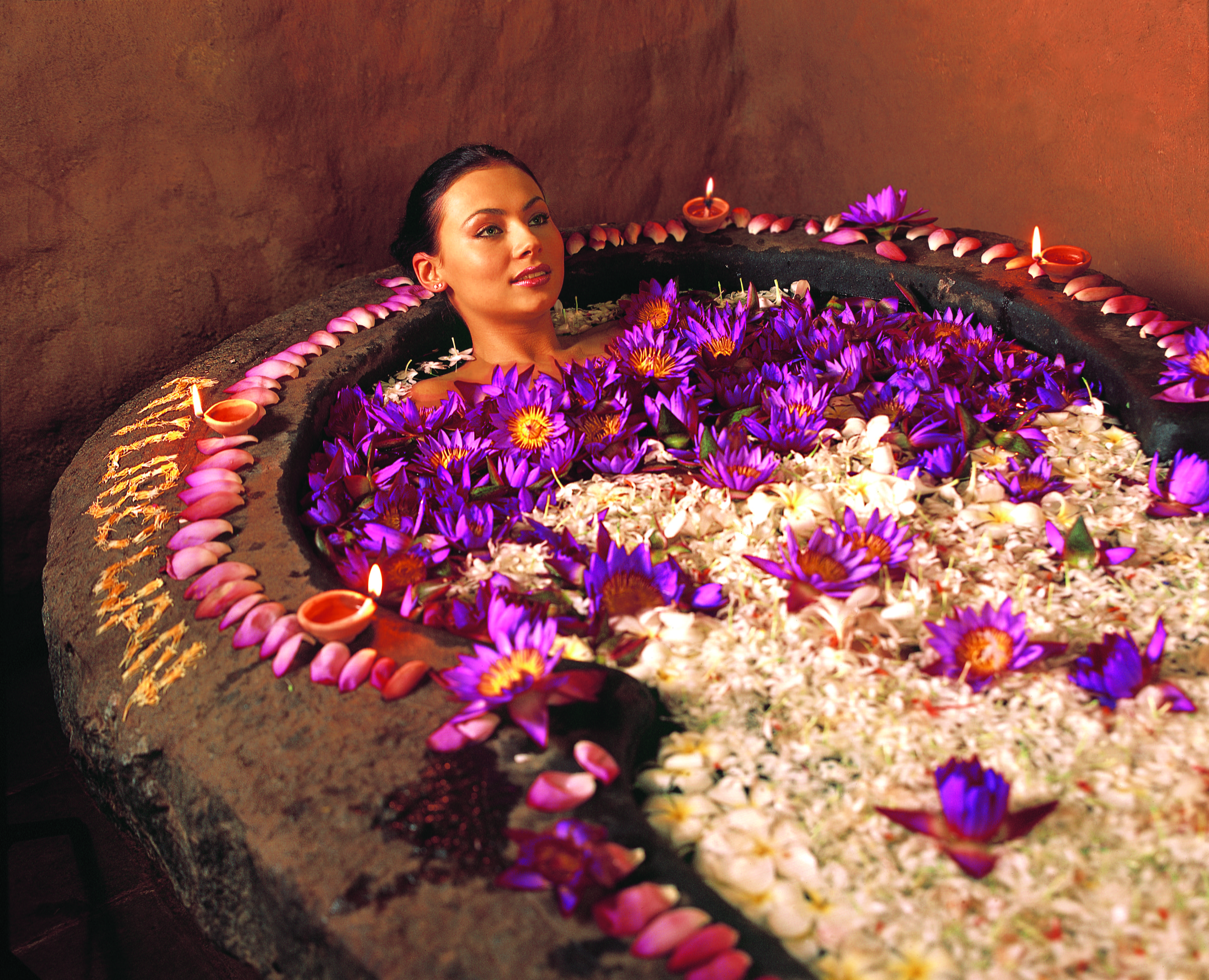 Traditional flower bath prepared for an Ayurveda experience
