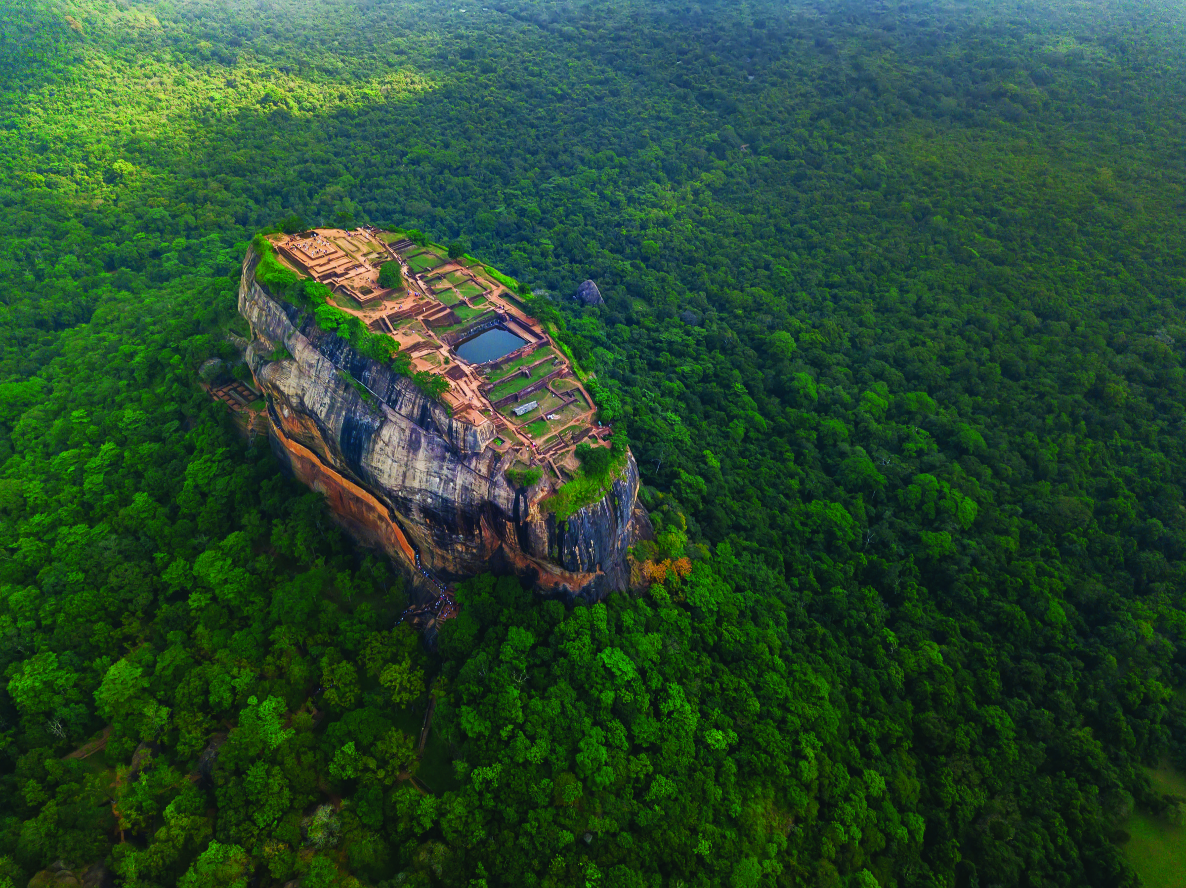 Aerial view of Sigiriya surrounded by green forest
